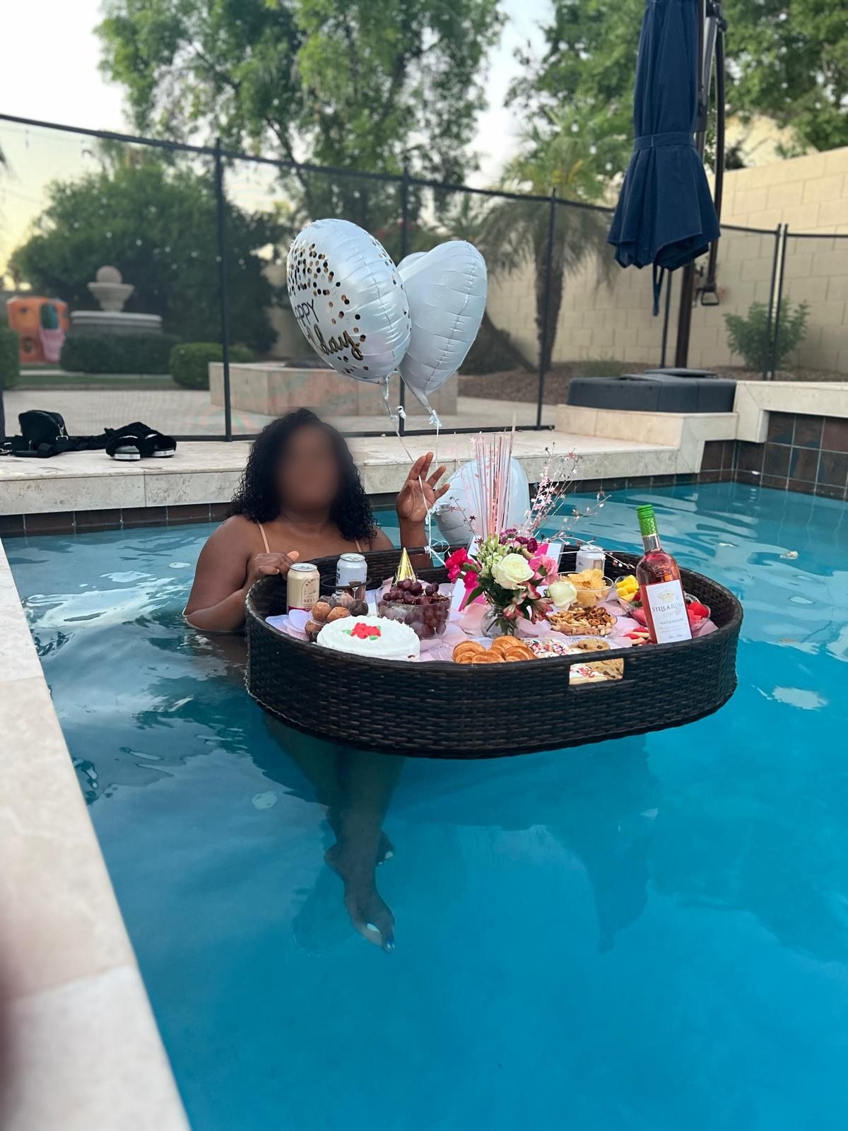 Guest enjoying a floating brunch in the pool